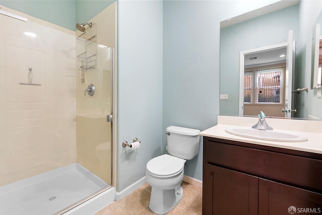 full bath featuring toilet, a stall shower, tile patterned floors, and vanity