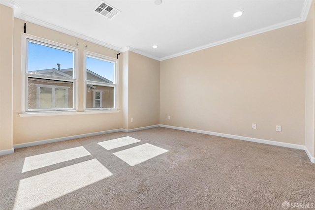 unfurnished room with light carpet, baseboards, visible vents, and crown molding