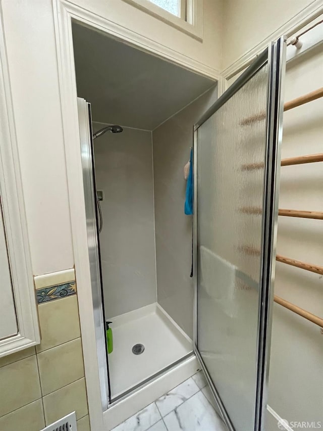 bathroom featuring walk in shower