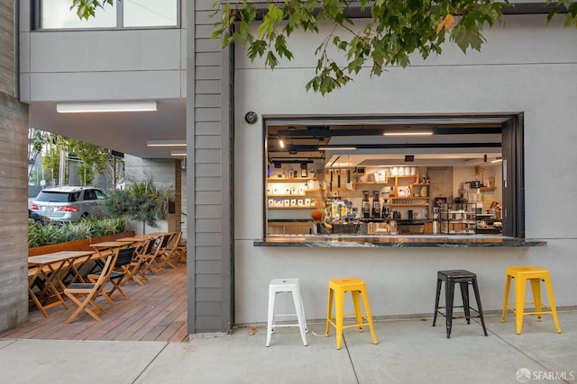 bar featuring concrete floors