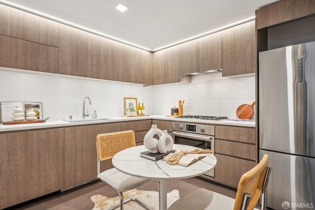 1300 22nd St Unit 220, San Francisco, CA 94107 - kitchen with stainless steel appliances, tasteful backsplash, light countertops, and modern cabinets