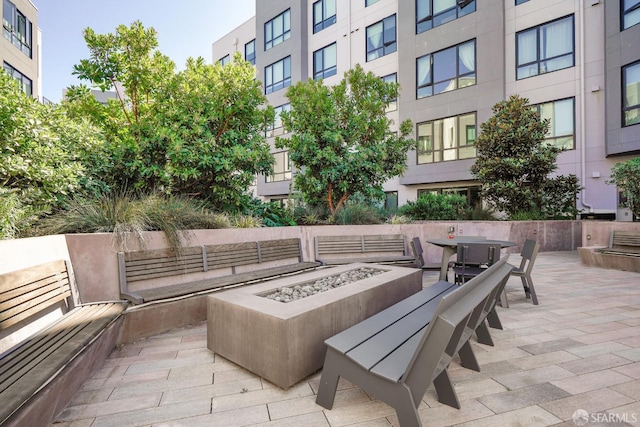 view of patio / terrace featuring an outdoor fire pit