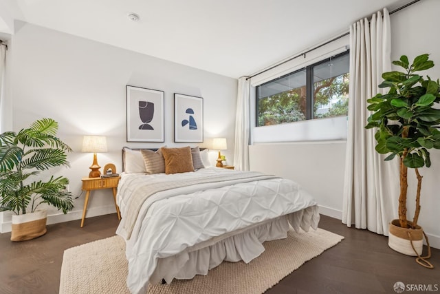 bedroom featuring dark hardwood / wood-style flooring