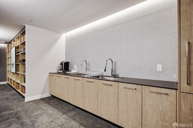 kitchen featuring decorative backsplash, sink, and light brown cabinets