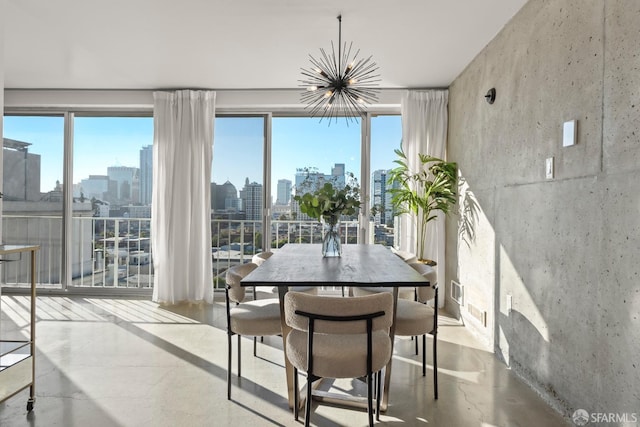 sunroom / solarium with a view of skyline, a chandelier, and healthy amount of natural light