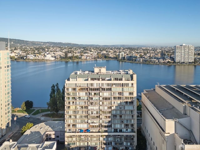 birds eye view of property with a water view