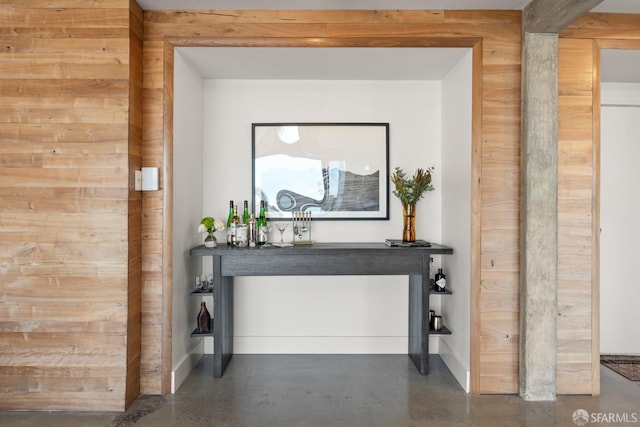 interior space featuring wooden walls