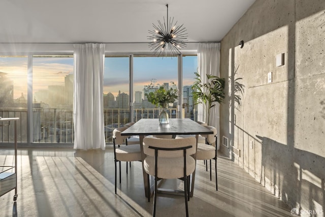 sunroom with a chandelier and a city view