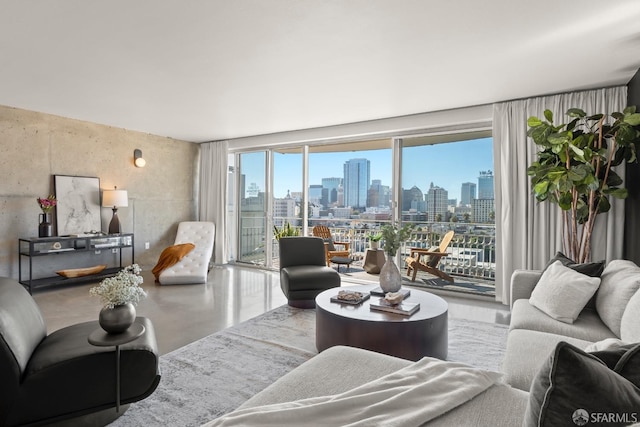 living room with a skyline view and finished concrete floors