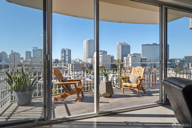 doorway with a view of skyline and floor to ceiling windows