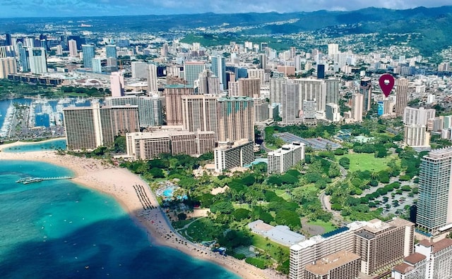 view of city featuring a mountain view and a beach view