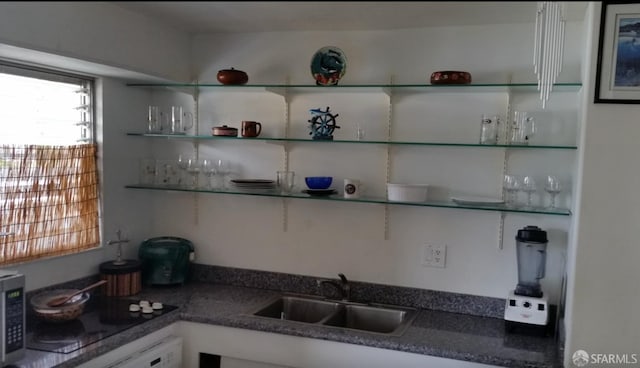 kitchen with open shelves, black electric cooktop, a sink, dark countertops, and wall oven