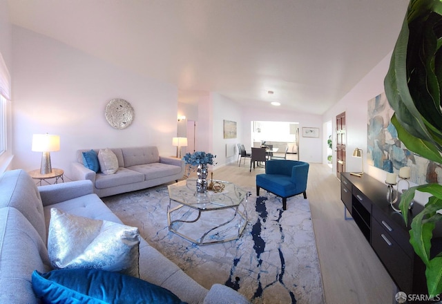 living room with vaulted ceiling