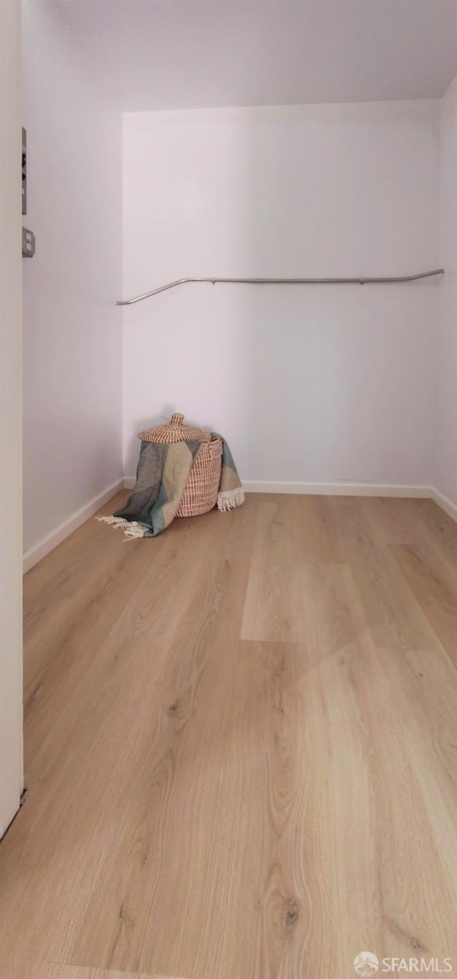 unfurnished room with light hardwood / wood-style floors