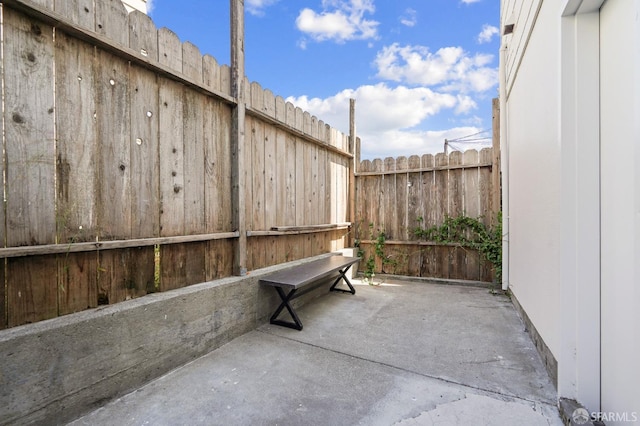 view of patio featuring fence