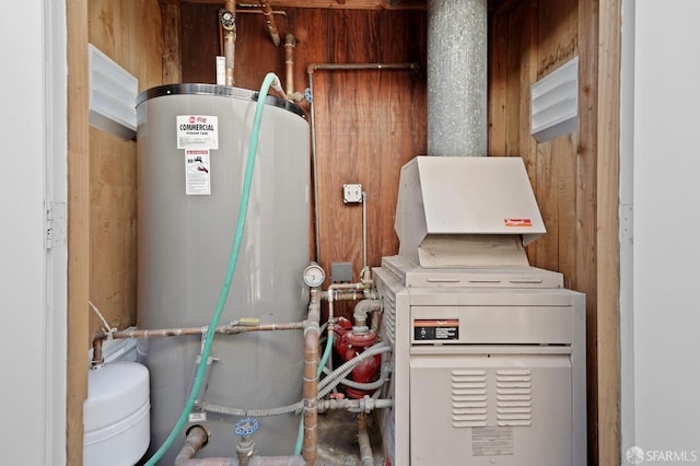 utility room featuring water heater