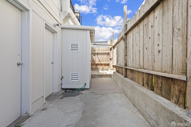 view of patio featuring fence