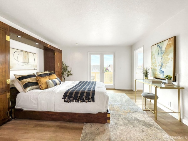 1113 Pebblewood Way, San Mateo, CA 94403 - bedroom featuring baseboards, access to outside, and light wood-style floors