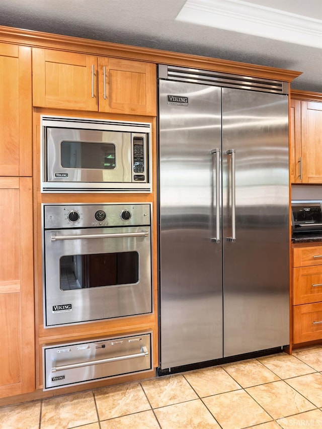 1113 Pebblewood Way, San Mateo, CA 94403 - kitchen with a warming drawer, dark countertops, light tile patterned floors, and built in appliances