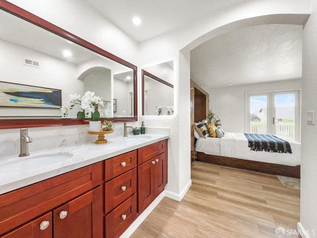 1113 Pebblewood Way, San Mateo, CA 94403 - full bath featuring visible vents, wood finished floors, ensuite bath, and a sink