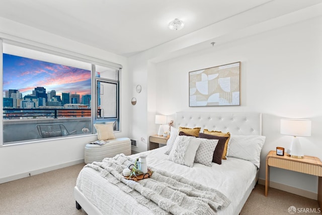 177 Townsend St Unit 925, San Francisco, CA 94107 - carpeted bedroom featuring baseboards and a skyline view