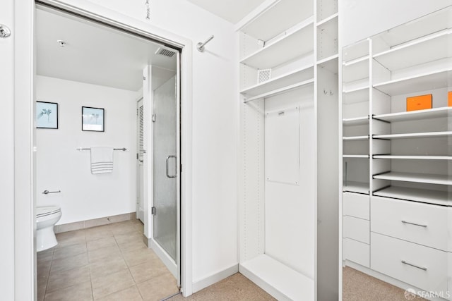 walk in closet with light tile patterned floors and visible vents