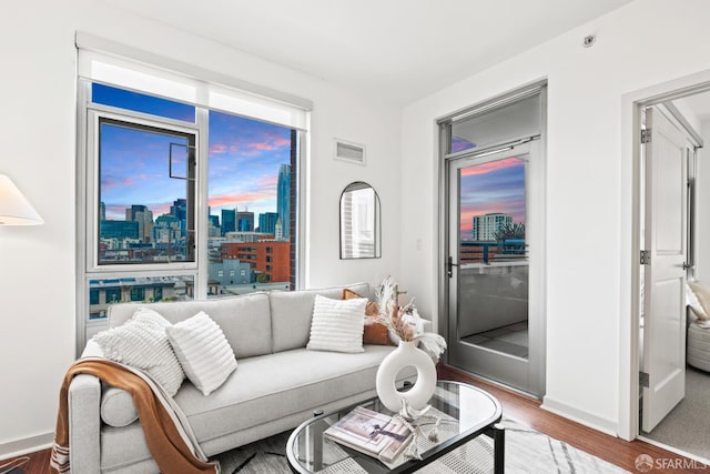 177 Townsend St Unit 925, San Francisco, CA 94107 - living area with wood finished floors and a view of skyline