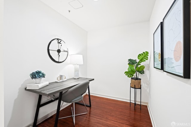 office featuring baseboards and wood finished floors