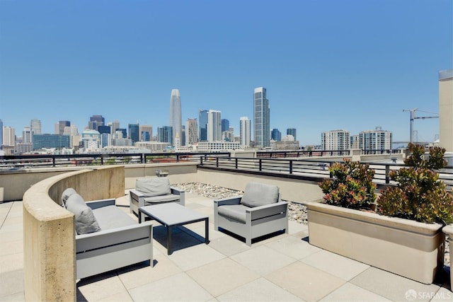 view of patio with a city view and an outdoor hangout area