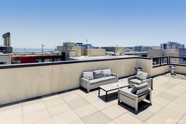 view of patio featuring an outdoor living space and a city view