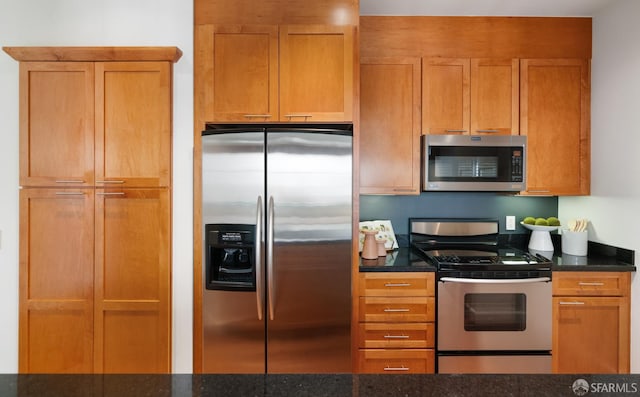 351 Buena Vista E Avenue 604E, San Francisco, CA 94117 - kitchen featuring stainless steel appliances, dark stone countertops, and brown cabinets