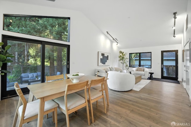 206 Donohoe St, East Palo Alto, CA 94303 - dining area featuring track lighting, lofted ceiling, and wood finished floors