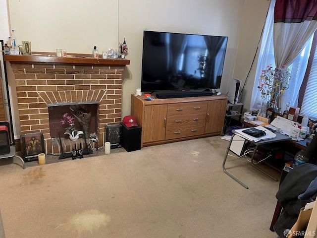 carpeted living room with a brick fireplace