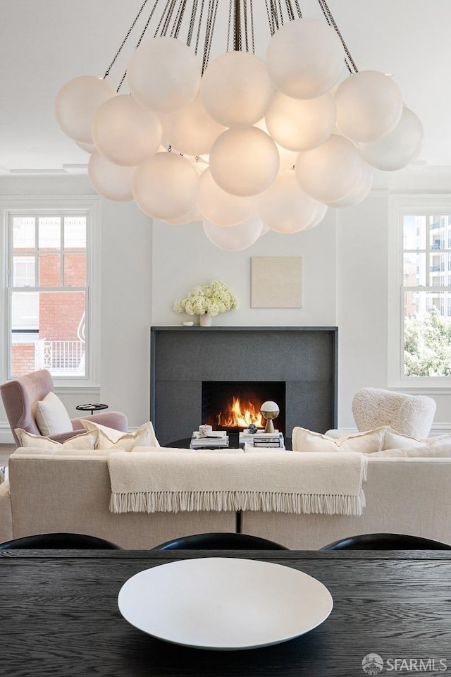 living area with a warm lit fireplace