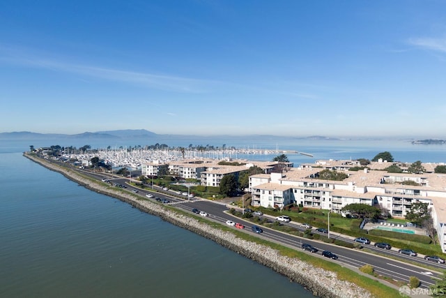 birds eye view of property featuring a water and mountain view