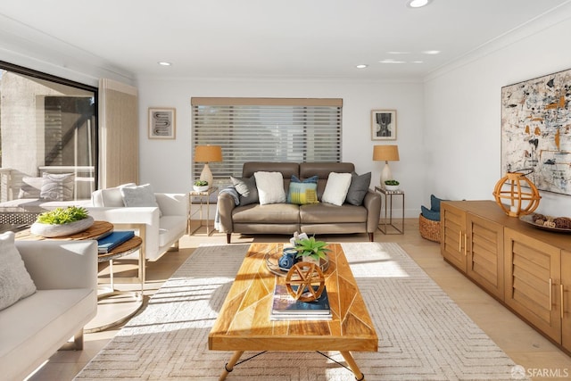 living room with light wood-type flooring and ornamental molding