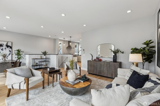 living room featuring light wood-style flooring and recessed lighting