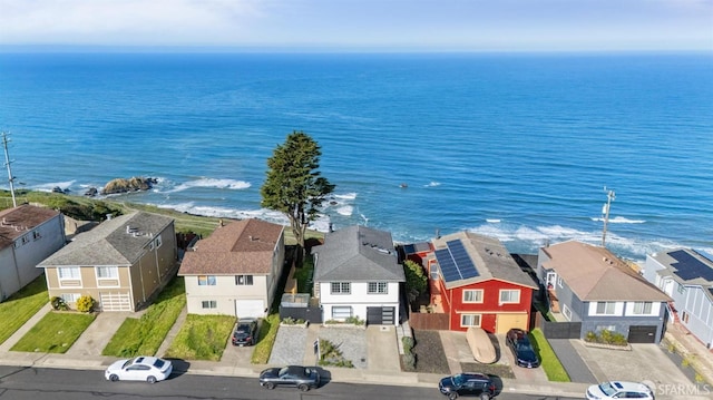 bird's eye view with a water view and a residential view