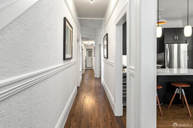 213 Virginia Ave, San Francisco, CA 94110 - corridor with dark wood finished floors and a textured wall
