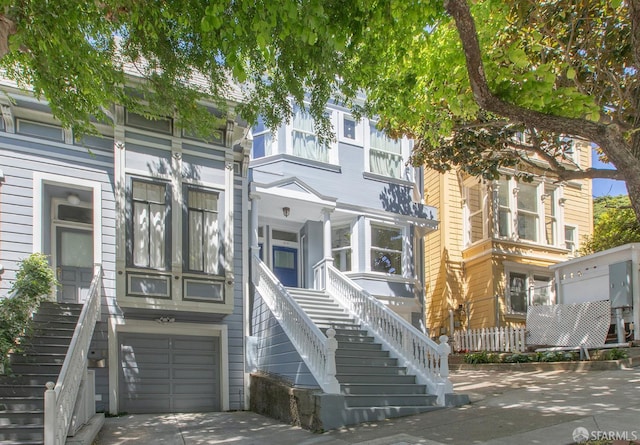 213 Virginia Ave, San Francisco, CA 94110 - townhome / multi-family property featuring stairway, an attached garage, and driveway