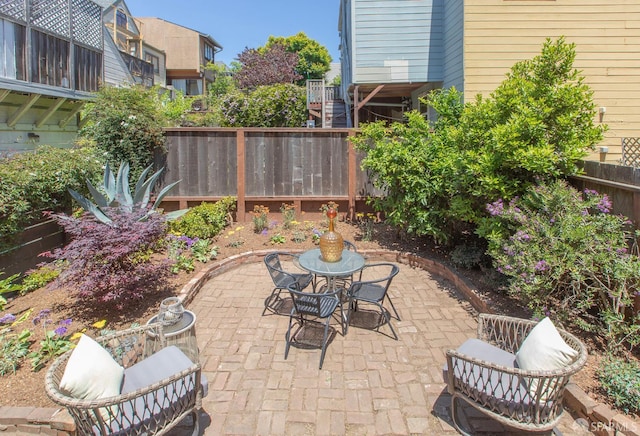 213 Virginia Ave, San Francisco, CA 94110 - fenced backyard featuring a patio area and outdoor dining area