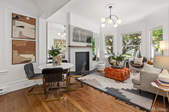 213 Virginia Ave, San Francisco, CA 94110 - living area featuring wood finished floors, plenty of natural light, and a chandelier