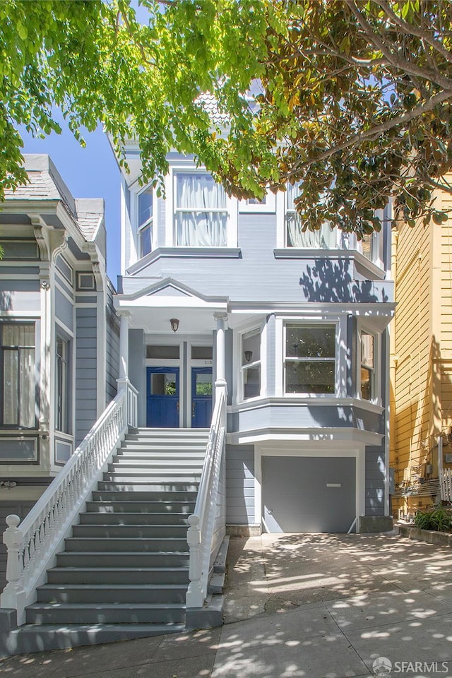 213 Virginia Ave, San Francisco, CA 94110 - townhome / multi-family property with stairway, an attached garage, and concrete driveway