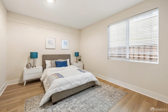 bedroom featuring wood-type flooring