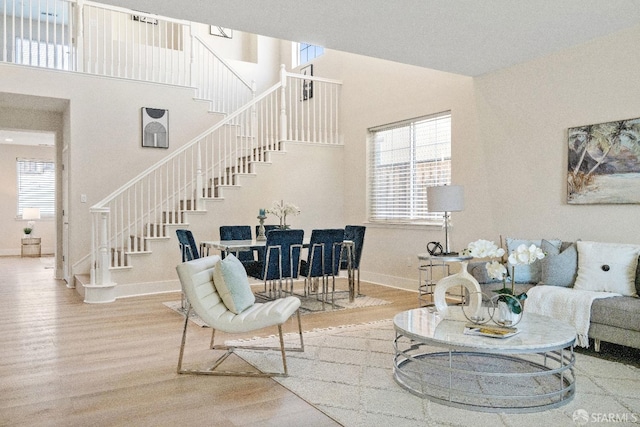 living room with hardwood / wood-style floors and a healthy amount of sunlight