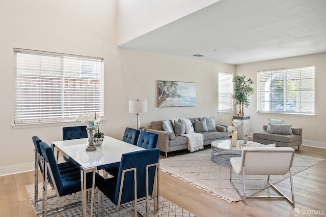 dining space featuring light hardwood / wood-style flooring