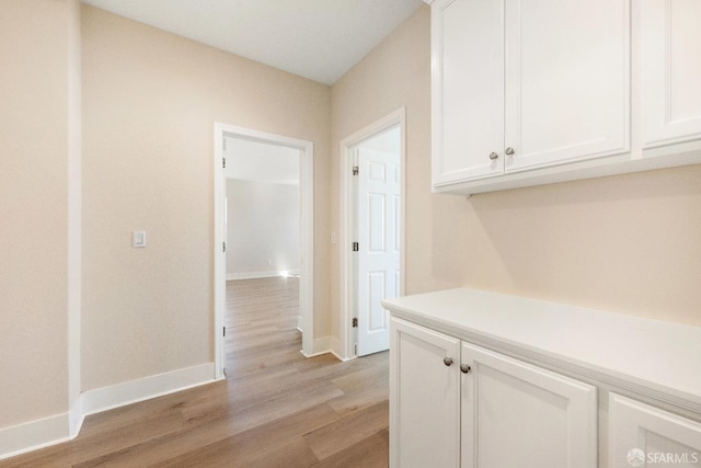 hall with light wood-type flooring