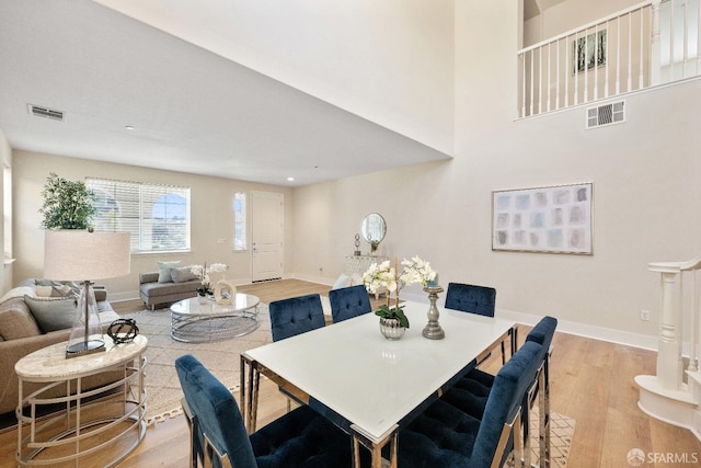 dining area featuring light wood-type flooring