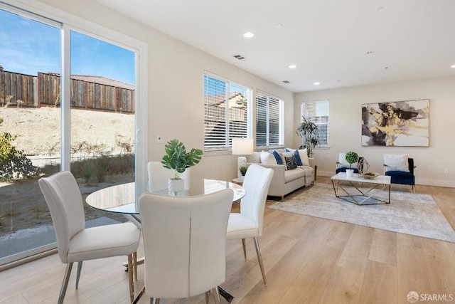 dining space featuring light hardwood / wood-style floors