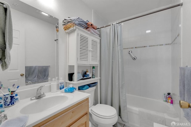 full bathroom featuring shower / bath combo with shower curtain, vanity, and toilet